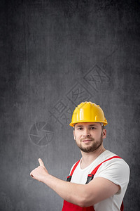 眼睛建筑工人用手指着墙工人用手指着墙建造人们图片