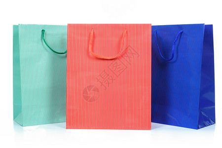 三袋不同颜色的购物袋紧闭并隔离在白色背景上3袋商业的包裹不同图片