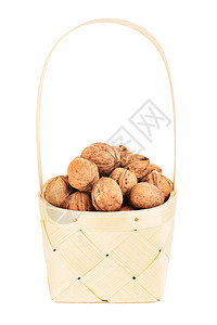 素食主义者说谎木制篮子中的胡桃在Wooden篮子里的白色背景上被孤立木头图片