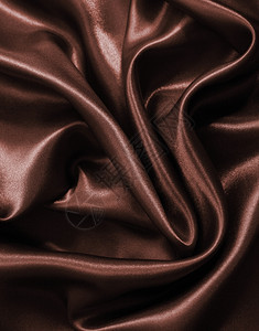平滑优雅的深褐色巧克力丝可用作背景装饰缎面情人节图片