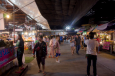 夜市摊上的热闹情景背景图片