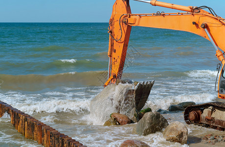 结石海滩桶岸上施工设备防波堤施工海岸保护措施上工设备图片