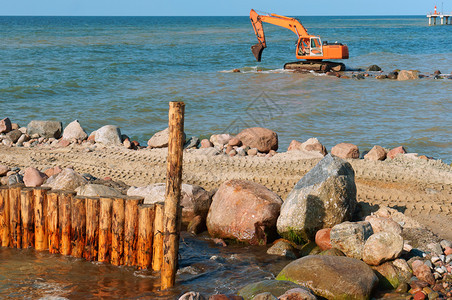 岸上施工设备防波堤施工海岸保护措施防波堤工建筑学行业海滩图片