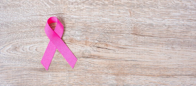 10月乳腺癌意识关于支持人们生活和疾病保健国际妇女节和世界癌症日概念的木材背景粉红丝带1月国际妇女节和世界癌症日概念治愈国际的疗图片
