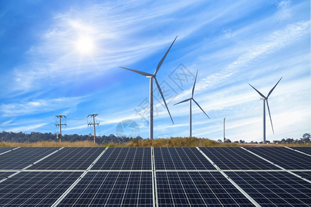 电气行业农场光伏模块太阳能发电厂风力涡轮机与云替代清洁能源概念对准蓝天空和色图片