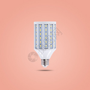 粉彩电气白炽灯LED节能230v以橙色糊背景隔离用于节能和环境保护概念使用LED节能灯230v图片