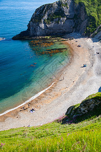 赛特海滩白色的英国夏日度假目的地DorsetJurassic海岸空中观察图片