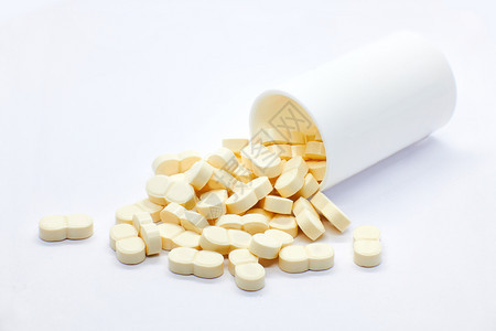 药物医疗保险白色背景上从瓶子里出来的药丸医疗补助图片