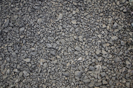 蓝色和灰海军深蓝宝石背景抽象的小型石质纹理天然块岩质纹理在顶部拍摄一张照片圆形的不均匀卵石图片
