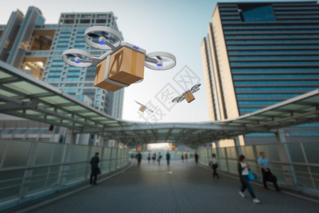 无人驾驶飞机在城市中携带送货箱包电梯邮件未来图片