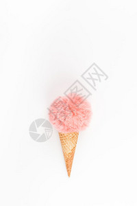 冰淇淋华夫饼锥壳中珊瑚彩色毛皮球白背景空间的复制版面以最微小的风格呈现在创世最高视野上概念女博客社交媒体有阴影的自然光美丽蓬松时图片