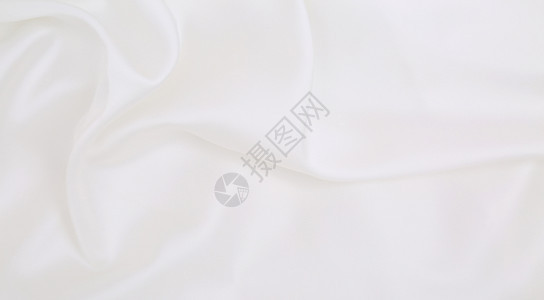 平滑优雅的白色丝绸或席边奢华豪布质料可用作婚礼背景淫秽设计白色的或者装饰图片