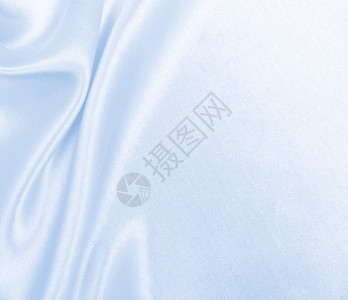 平滑优雅的蓝色丝绸或席边奢华布质料可用作抽象背景本色设计冬天银色时尚图片
