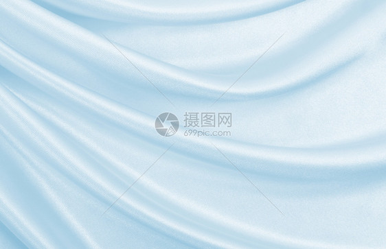 平滑优雅的蓝色丝绸或席边奢华布质料可用作抽象背景本色设计投标自然新的图片
