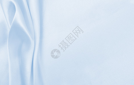 柔软的材料新平滑优雅蓝色丝绸或席边奢华布质料可用作抽象背景本色设计图片