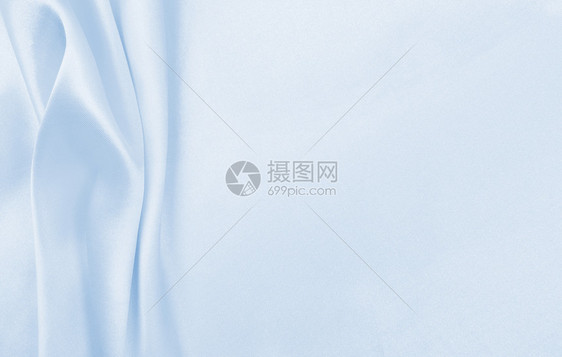 柔软的材料新平滑优雅蓝色丝绸或席边奢华布质料可用作抽象背景本色设计图片