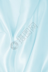 质地平滑优雅的蓝色丝绸或席边奢华布质料可用作抽象背景本色设计艺术的曲线图片