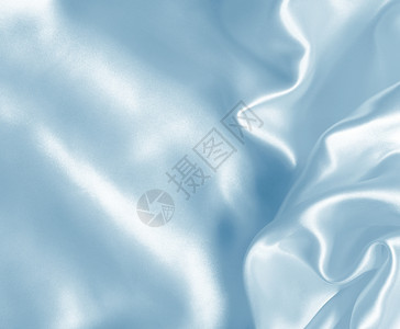 平滑优雅的蓝色丝绸或可用作背景美丽的能够新图片