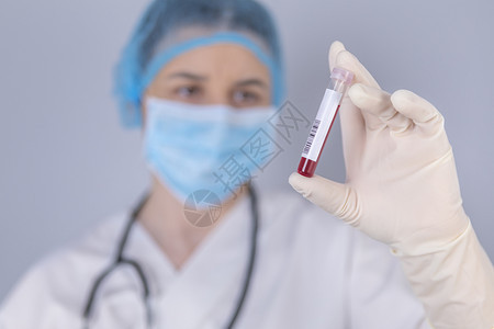 感染保护士持有测试血样的液本测试和研究概念重点在血液测试管上健康图片