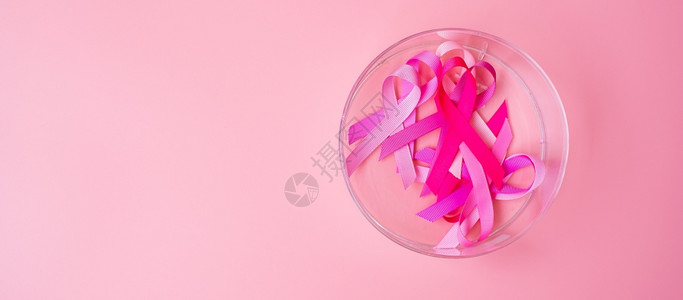 关心10月提高乳腺癌意识月粉红背景色丝带以支持人们生活和疾病支持国际妇女母亲和世界癌症日概念国际妇女母亲和世界癌症日概念帕努瓦胸图片