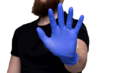 Manrsquos戴上蓝色医用手套上面写着待在家里自我隔离或检疫covid19冠状Stop冠状保护爱斗争图片