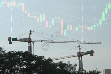 投资建造花费商业股票图背景建筑起重机的双曝光量图片