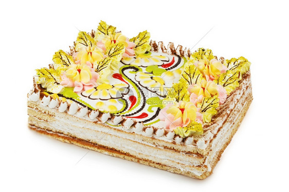 饮食浆果三角形以白背景孤立的鲜奶油花为装饰的饼干蛋糕图片
