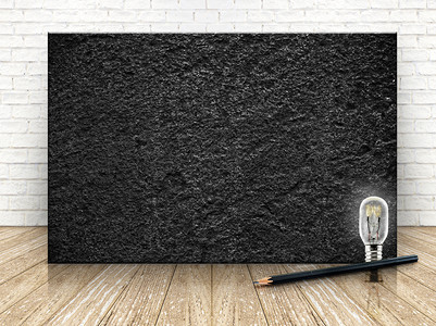 阴影简单的白砖墙和木地板上的黑色石块供你使用商业图片