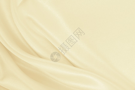 抽象的缎平滑优雅金丝绸或席边奢华布质料可用作婚礼背景彩色设计用在SepiatonedRetro风格上或者图片