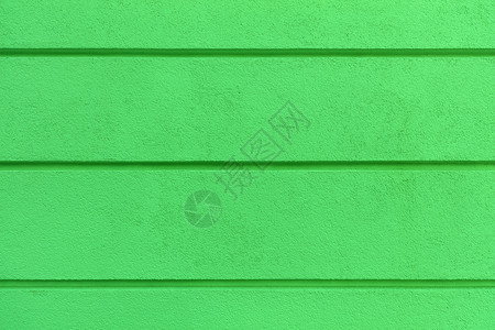 装饰坚硬风格混凝土墙体纹理彩色亮绿抹灰墙体保温材料施工灰泥带水平分隔槽混凝土墙体纹理亮绿色抹灰墙上有水平分隔槽图片
