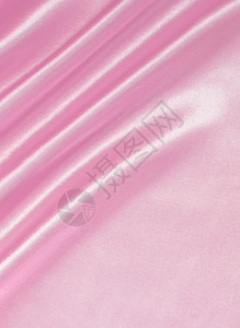 平滑优雅的粉色丝绸或可以用作婚礼背景莫罗佐娃曲线质地图片