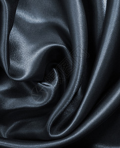 平滑优雅的深灰色丝绸或可用作背景丝滑柔软度黑暗的图片