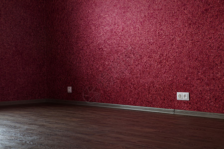 镶木地板墙用于出租或售的空红色房间一部分空图片