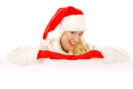 季节微笑扮成圣诞老人的感女孩将手指向广告空间女图片