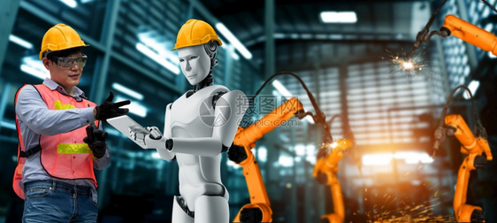 电脑机械化工业器人与类工在未来厂中协同作业革命和自动化制造过程的人工智能概念机械化工业器人和类工在未来厂中协同作断机器人技术图片