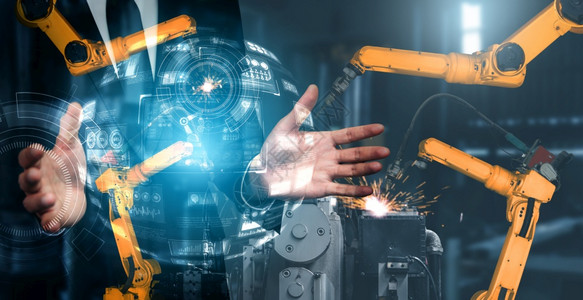 竞赛机械化工业器人手臂和工厂双曝光业革命和自动化制造过程的机器人技术概念械化工业器人手臂和工厂双曝光技术员图片