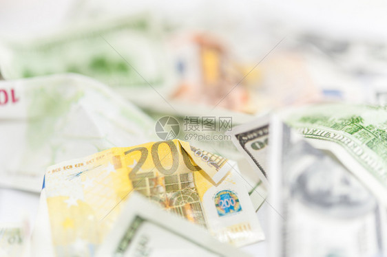经济许多美元和欧主要货币近身伪冒的美国和欧元折叠钞票背景财务和商业概念假美元和欧折叠货币背景金融和商业概念假美元和欧回收纸图片