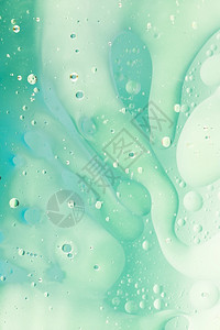 具有抽象绿色背景分辨率和高品质美丽光水泡沫具有抽象绿色背景的精密高品质和清晰度的美照片概念以及高质量和清晰度的优美照片概念飞沫透图片