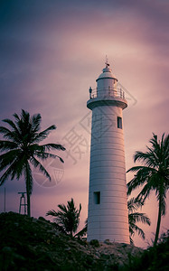 殖民白色的GalleLighthouse晚夕日落彩色摄影海滩图片