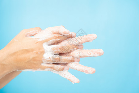在蓝背景洗手示范中用白肥皂泡沫洗手进行保护的洗手示范卫生概念和预防腐蚀19b卫生和预防方法19皮肤亚洲人药物图片