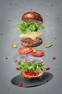 芝士汉堡新鲜原料的特异视图美味温暖汉堡食品以灰色底板和盘子飘浮爆炸一顿饭自制图片