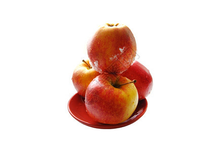 圆形的盘子上漂亮苹果在白色背景上被孤立富有的闻图片