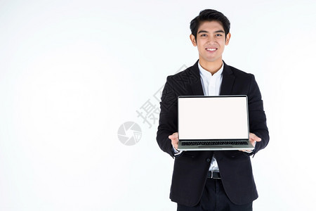 幸福无线的英俊亚洲青年商人与笔记本电脑合作的时装肖像其空白屏幕孤立在色灰空复制间工作室背景商业成功概念上办公室图片