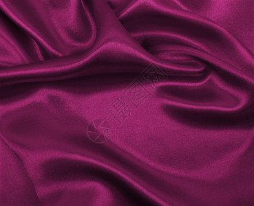 玫瑰闪耀粉色的平滑优雅粉色丝绸或席边奢华布质料可用作抽象背景淫秽设计图片