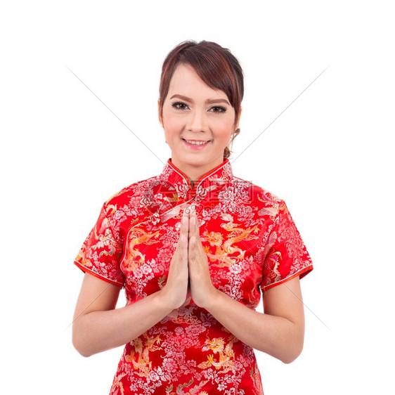亚裔女孩用传统文问候欢迎来宾把手掌放在一起敬礼的新年泰海脸快乐的传统图片