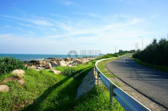 越南海岸美丽的景色海滩和道路之间的边界越南乡村的美丽景观街上的阴影越南边LagiBinhThuan的这种景象天空旅行木板图片