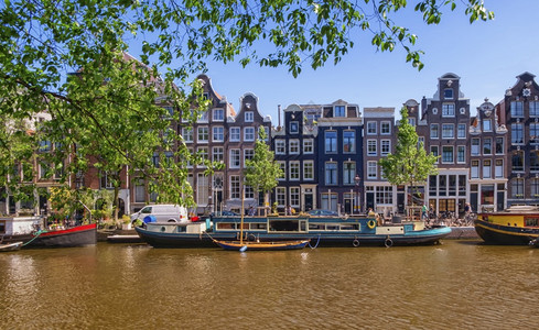 历史城市荷兰阿姆斯特丹典型建筑和运河白天荷兰阿姆斯特丹典型建筑和运河图片