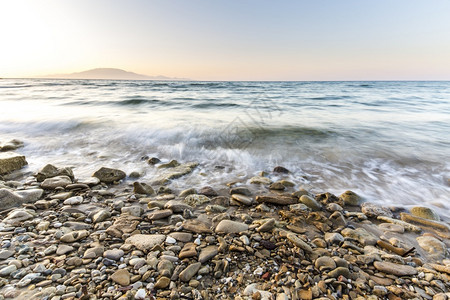 日落时的岩石海岸景象长期希腊Zakynthos春天墙纸反射背景图片