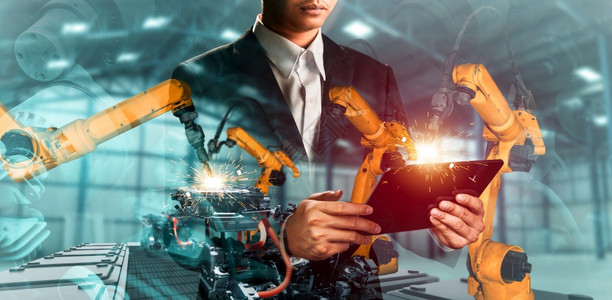人造的机器化智力械工业器人手臂和工厂双曝光业革命和自动化制造过程的机器人技术概念械化工业器人手臂和工厂双曝光图片