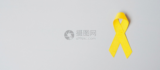 颜色保持九月预防Sarcoma骨头膀胱儿童癌症意识月黄丝带以支持人们生活和患病儿童保健世界癌症日概念保健及世界癌症日概念图片